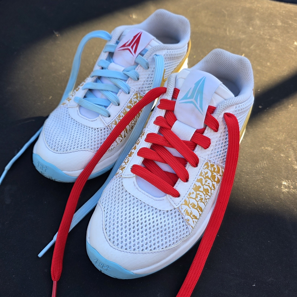 Nike Kids White Sneakers with Red and Blue Accents